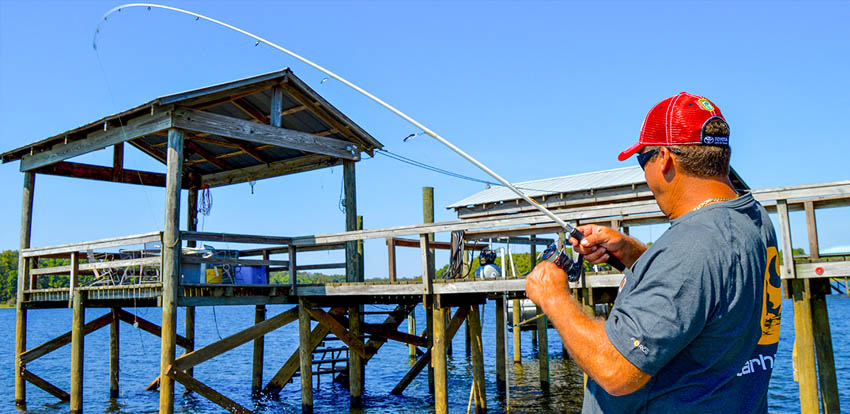 A man fishing from Shooting Docks